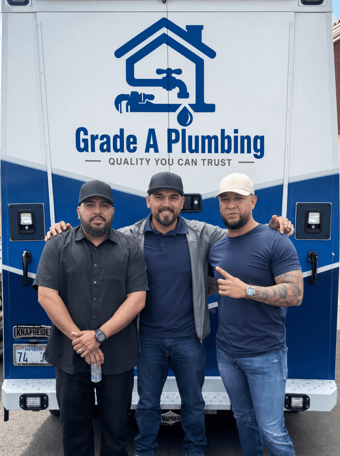 Grade A Plumbing team standing in front of the company service truck